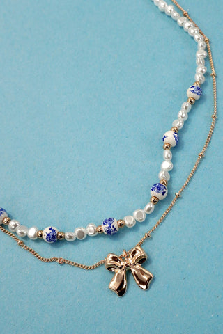 CERAMIC PORCELAIN PEARL BOW LAYER NECKLACE-Necklaces-JOSSLYN by wall to wall-Summit Lane Boutique, Women's Apparel and Gifts located in Grand Rapids, MI